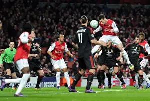 Arsenal Crushes AC Milan 3-0 in UEFA Champions League: Laurent Koscielny's Header Kicks Off the Victory