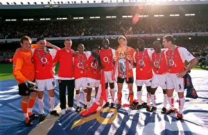 The Arsenal defenders and goalkeepers celebrate with the Premiership trophy