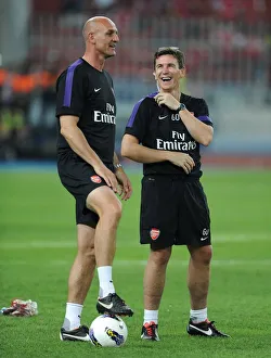 Malaysia XI v Arsenal 2012-13 Collection: Arsenal Doctor Gary O Driscoll shares a joke with Steve Bould Arsenal Assistant Manager