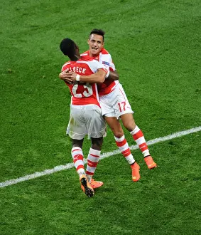 Arsenal V Galatasaray 2014/15 Champions League Prints: Arsenal Double Strike: Welbeck and Sanchez Celebrate Goals Against Galatasaray in Champions League
