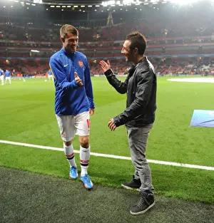 Arsenal V Napoli 2013-14 Prints: Arsenal Duo: Santi Cazorla and Aaron Ramsey Share a Moment Before Arsenal v Napoli