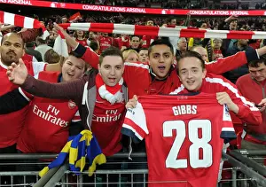 Arsenal V Wigan Athletic - FA Cup Semi Final 2014 Prints: Arsenal FA Cup Triumph: Fans Celebrate with Kieran Gibbs Shirt