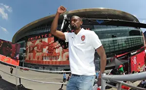 Arsenal Trophy Parade 2014 Prints: Arsenal FA Cup Victory: Abou Diaby's Triumph at the 2014 Parade