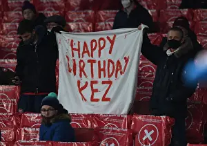 Arsenal Fans in Action: Cheering at Emirates Stadium during UEFA Europa League Match (Arsenal vs. SK Rapid Wien, 2020-21)