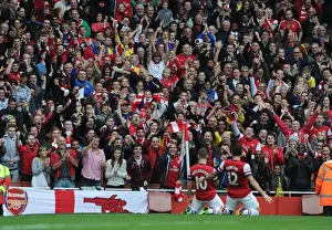 Arsenal V Norwich City 2013-14 Prints: Arsenal fans celebrate the 1st goal scored by Jack Wilshere. Arsenal 4: 1 Norwich City