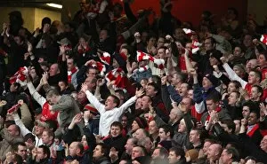 Images Dated 28th January 2008: The Arsenal fans celebrate Emmanuel Adebayors 1st goal