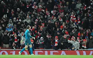Arsenal fans celebrate after goalkeeper Manuel Almunia saves the Hull penalty taken by Geovanni