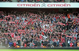 Images Dated 26th February 2012: Arsenal Fans Celebrate Goals Against Tottenham in the Premier League