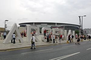 Images Dated 25th July 2006: Arsenal fans gather around the giant letters near the south bridge outside the Emirates Stadium