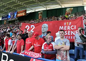 Arsenal Fans Honor Arsene Wenger with Banners at Huddersfield Match