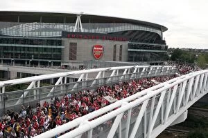 Images Dated 16th August 2008: Arsenal fans leave the stadium crossing the North Bridge