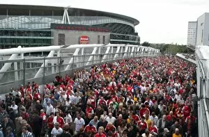 Images Dated 16th August 2008: Arsenal fans leave the stadium, crossing the North Bridge