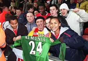 Liverpool v Arsenal - Carling Cup Collection: Arsenal fans with Manuel Almunias shirt after the match