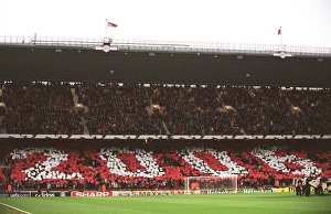 Arsenal v Villarreal 2005-6 Gallery: Arsenal fans in the North Bank hold up cards that read 2006