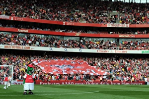 Arsenal v Liverpool 2010-2011 Collection: Arsenal fans send the banner round the stand. Arsenal 1: 1 Liverpool. Barclays Premier League