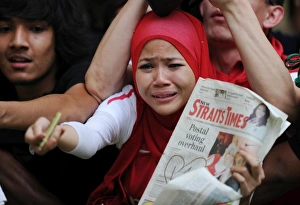 Arsenal fans. Suajuna Hotel, Kuala Lumpur, Malaysia, 13 / 7 / 2011. Credit