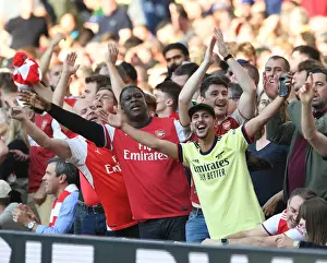 Arsenal V Tottenham Hotspur 2021-22 Prints: Arsenal Fans Triumph: The Euphoria of the Third Goal Against Tottenham in the 2021-22 Premier League Match