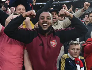 West Ham United V Arsenal 2021-22 Prints: Arsenal Fans Triumphant Euphoria: Celebrating a Hard-Fought Premier League Victory over West Ham United