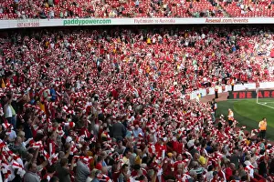 Arsenal Fans Unite: Scarves Raised in Triumph at Emirates Stadium (4:1 Win over Portsmouth, Barclays Premier League, 2009)