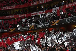 Arsenal V Atletico Madrid 2017-18 Prints: Arsenal Fans Unite: Waving Flags in Europa League Semi-Final Battle against Atletico Madrid