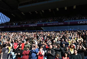 Aston Villa v Arsenal 2021-22 Collection: Arsenal Fans Unwavering Passion: A Premier League Showdown at Aston Villa, 2022