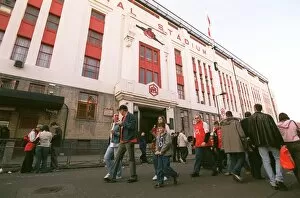 Fans Collection: Arsenal fans walk outside the East Stand before the match