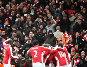 Arsenal V Bolton 2009-10 Prints: Arsenal Fans Go Wild: Celebrating the 3rd Goal in a 4-2 Victory over Bolton Wanderers (Barclays Premier League)