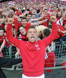 Arsenal FC: Celebrating FA Cup Victory with Lukas Podolski and Fans at Wembley Stadium
