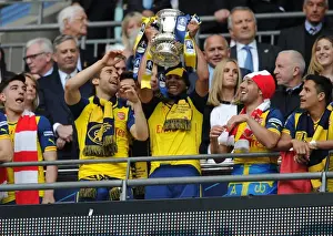Arsenal V Aston Villa - FA Cup Final 2015 Prints: Arsenal FC: Francis Coquelin Lifts the FA Cup after Triumphant Victory over Aston Villa