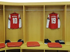 Third Round Prints: Arsenal FC: Jack Wilshere and Santi Cazorla's Empty Changing Room Gear - Arsenal v Swansea FA Cup Replay (2013)
