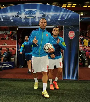 Arsenal V Galatasaray 2014/15 Champions League Prints: Arsenal FC: Lukas Podolski and Alexis Sanchez Prepare for Galatasaray Clash in Champions League (2014)