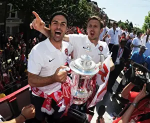 Arsenal Trophy Parade 2014 Prints: Arsenal FC: Mikel Arteta and Nacho Monreal Celebrate FA Cup Victory (2014)