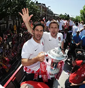 Arsenal Trophy Parade 2014 Prints: Arsenal FC: Mikel Arteta and Nacho Monreal Celebrate FA Cup Victory (2014)