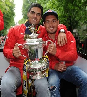 Images Dated 31st May 2015: Arsenal FC: Mikel Arteta and Santi Cazorla Celebrate FA Cup Victory (2014-15)