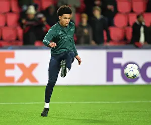 PSV Eindoven V Arsenal 2023-24 Prints: Arsenal FC at PSV Eindhoven: Group B - UEFA Champions League 2023/24: Ethan Nwaneri's Pre-Match Warm-Up