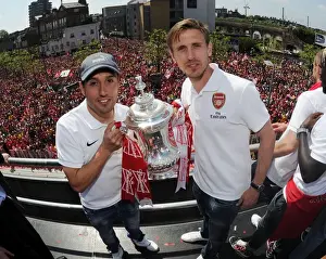 Arsenal Trophy Parade 2014 Prints: Arsenal FC: Santi Cazorla and Nacho Monreal Celebrate FA Cup Victory in London, May 2014