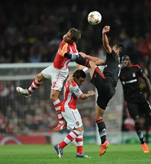 Arsenal V Besiktas 2014/15 Prints: Arsenal FC vs Besiktas JK: Flamini and Cazorla Clash in UEFA Champions League Qualifier