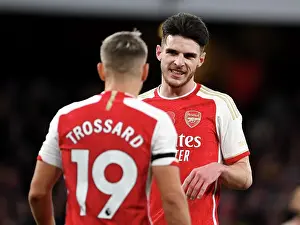 Arsenal FC vs Burnley FC: Interaction Between Rice and Trossard during the 2023-24 Premier League Match