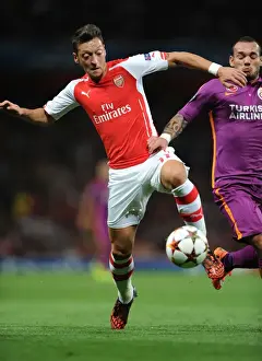 Arsenal V Galatasaray 2014/15 Champions League Prints: Arsenal FC vs Galatasaray AS: Mesut Ozil in Champions League Action at Emirates Stadium