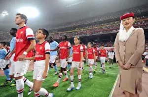 Arsenal FC vs Manchester City: Jenkinson and Gervinho Prepare for Battle in Beijing