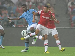 Arsenal V Man City - Pre Season 2012-13 Prints: Arsenal FC vs Manchester City: Oxlade-Chamberlain vs Razak Clash in Beijing Pre-Season Friendly