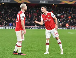 Arsenal FC vs Olympiacos FC: Europa League Clash - Mustafi and Xhaka in Action