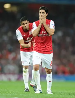 Arsenal FC vs Olympiacos FC: Mikel Arteta and Andre Santos in Action, UEFA Champions League 2011-12