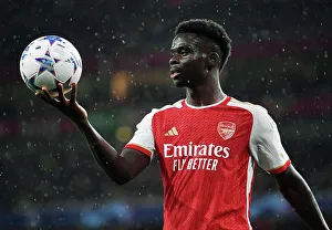 Arsenal FC vs PSV Eindhoven: Bukayo Saka's Intense Stare at Emirates Stadium - UEFA Champions League 2023/24