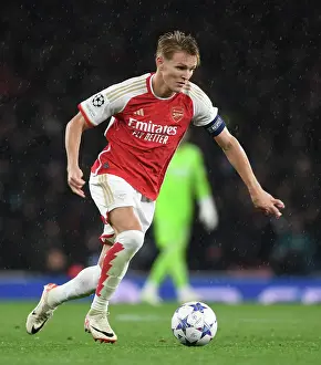 Arsenal V PSV Eindhoven 2023-24 Prints: Arsenal FC vs PSV Eindhoven: Champions League Clash - Martin Odegaard in Action