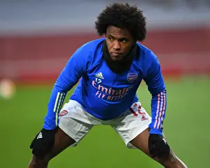 Arsenal V Slavia Prague 2020-21 Prints: Arsenal FC vs Slavia Praha: UEFA Europa League Quarterfinal - Willian Warming Up at Empty Emirates Stadium