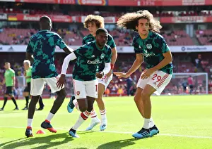 Arsenal V Tottenham Hotspur 2019-20 Prints: Arsenal FC vs. Tottenham Hotspur: Pre-Match Warm-Up - Battle-Ready: Maitland-Niles and Guendouzi (2019-20)