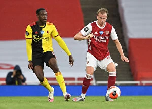Images Dated 26th July 2020: Arsenal FC vs Watford FC: Intense Moment Between Danny Welbeck and Rob Holding at Emirates Stadium