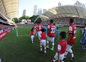 Arsenal Football Club: Pre-Season Friendly Match Against Kitchee FC in Hong Kong (2012) - Arsenal Team Walks onto the Pitch