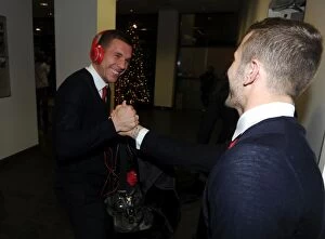 Images Dated 23rd December 2013: Arsenal Football Club: Lukas Podolski and Jack Wilshere Shake Hands Before Arsenal v Chelsea